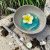 ÉKSZERTARTÓ - VALÓDI KÓKUSZDIÓ GYŰRŰTARTÓ - PLUMERIA VIRÁGGAL - GYANTACSODÁK